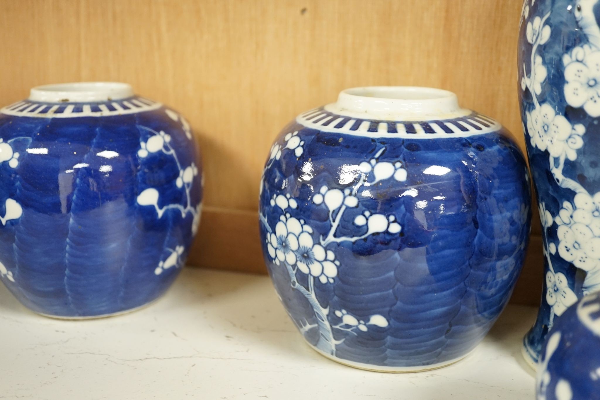 A pair of Chinese blue and white vases and eleven jars, six with covers., Vase and matching cover 28 cms high.